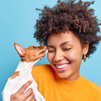 Woman With Dog Cyan Wall, Orange Shirt